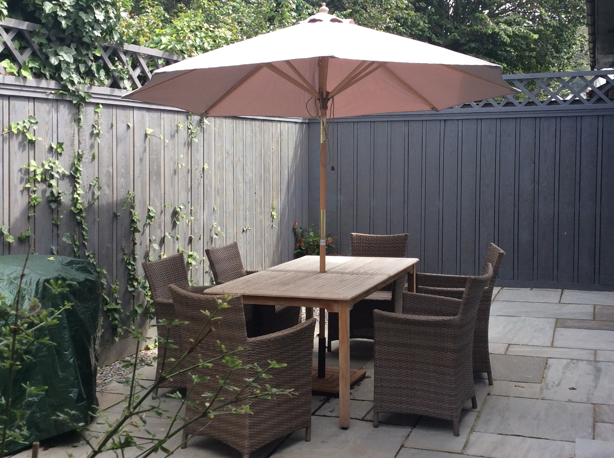 Private garden with outdoor dining and BBQ area